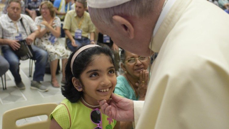 Pope Francis greeting young girl