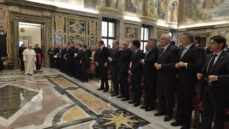Pope Francis greets participants attending an International Conference on Anti-Semitism