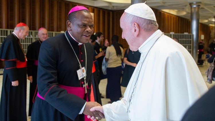 Archbishop (now Cardinal) Fridolin Ambongo meets with Pope Francis in this archive photo from 2019