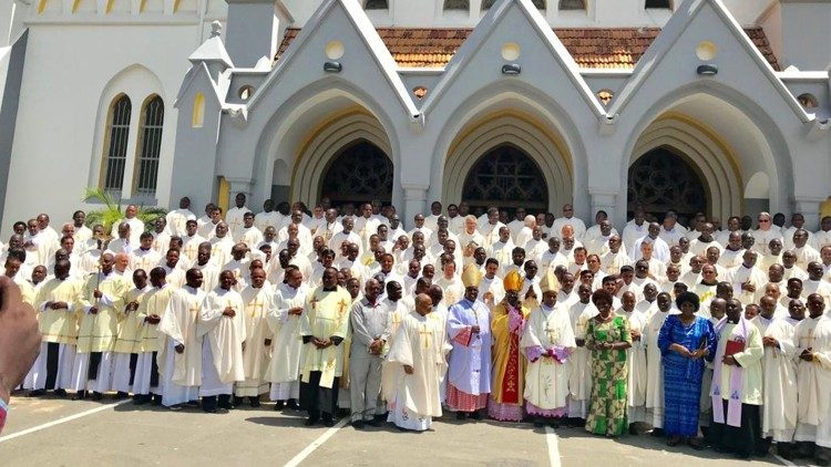  Cardinal Pengo with priests of the Archdiocese of Dar-es-Salaam pose for a photo in front of the Cathedral 