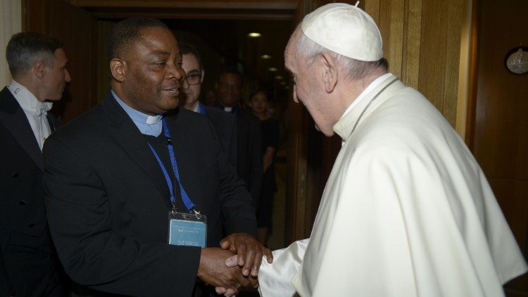Nigerian Jesuit Priest, Fr Ikechi Ikena of the Dicastery for Human Development greeting Pope Francis