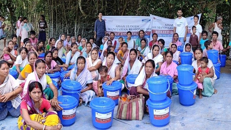 Caritas distributing relief material to flood affected people in India's Assam state.