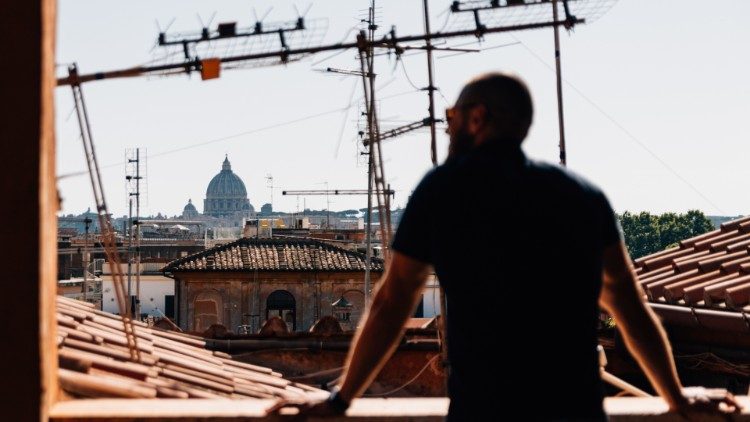 Maksym on a rooftop overlooking St. Peter’s Basilica