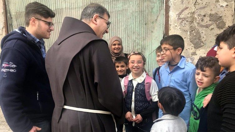 Fr Firas Lufti and children of the Therapeutic Art project
