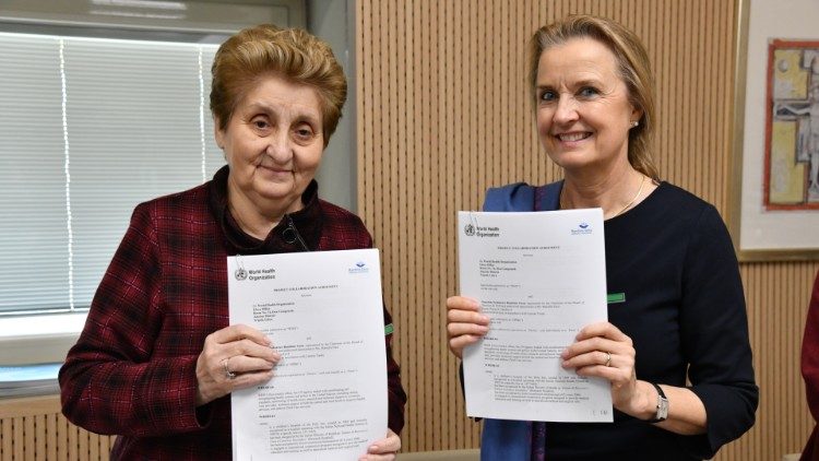 Mariella Enoc and Elizabeth Hoff sign the partnership agreement 