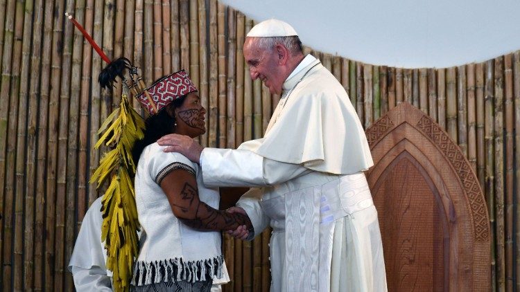 Pope Francis greets an indigenous woman in Puerto Maldonado, Peru