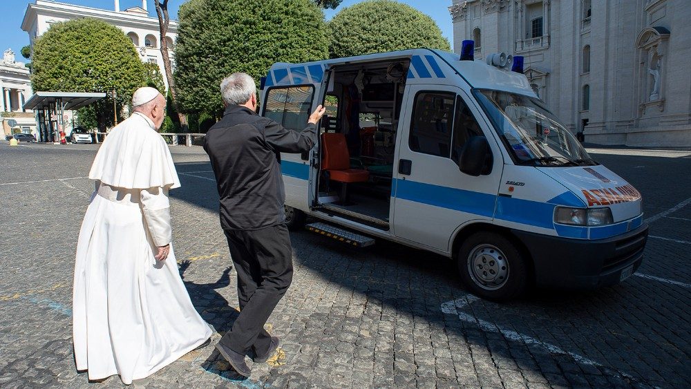 Cardinal Krajewski shows the ambulance to the Pope
