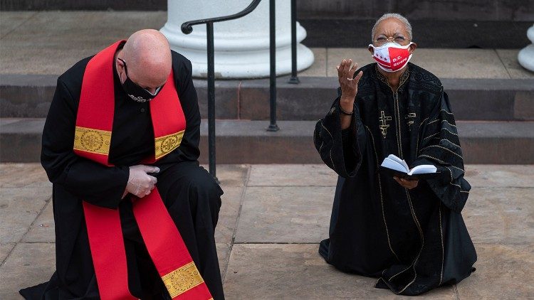 Christian religious leaders kneel in prayer for George Floyd