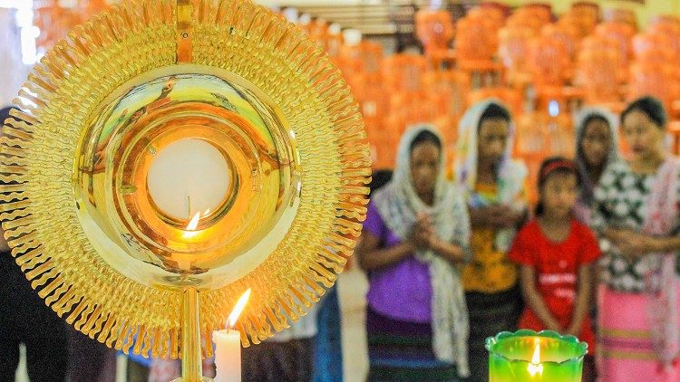 Adoration and prayer by Miao women of Miao Diocese, India. 