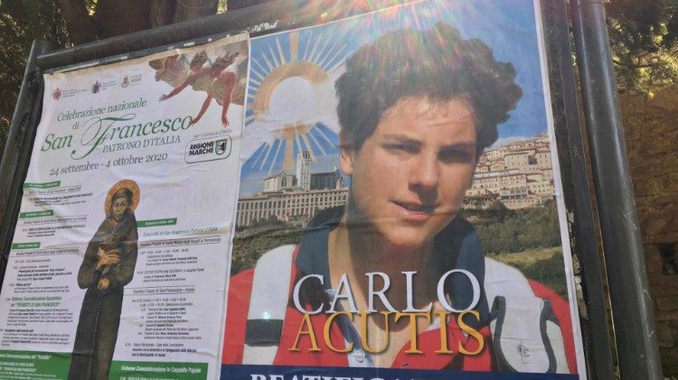 Poster promoting Carlo Acutis' beatification in Assisi appears side by side with program for celebrations for the Feast of St Francis