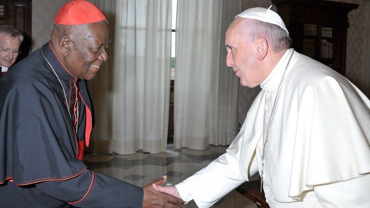 The late Cardinal Christian Tumi greets Pope Francis