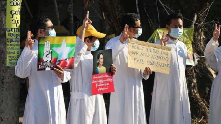 Catholic priests joining Myanmar 's proests against the military coup,  demanding the restoration of their elected government and leaders.  
