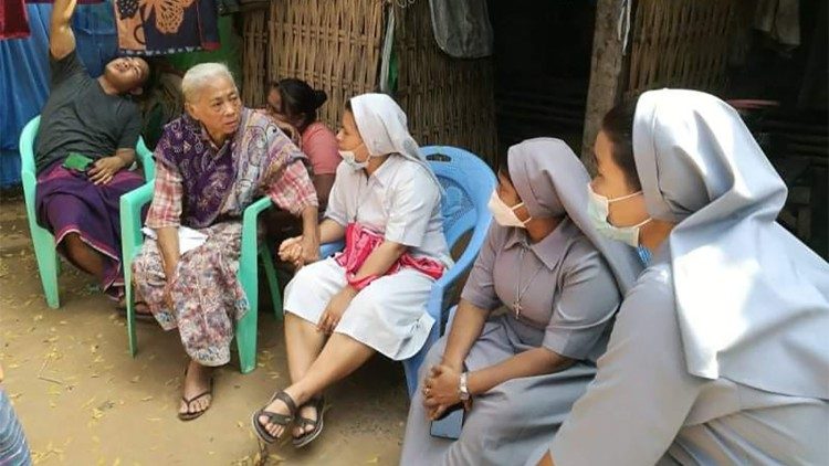 23 February, Sisters comforting the grandmother of the 16-year-old boy beaten in recent protests in Mandalay