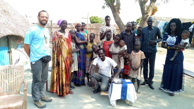 Bishop-elect Christian Carlassare with his community in South Sudan