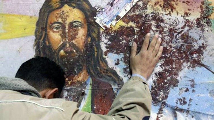A defaced mural depicting Jesus Christ