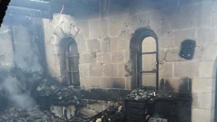 File photo of the vandalization of the Basilica of the Multiplication of the Loaves and Fishes in Tabgha in 2015