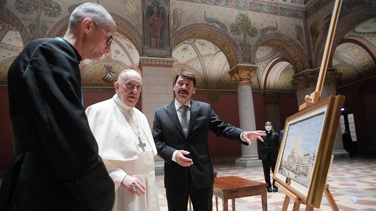 Pope Francis and President Ader admire the Pope's gift