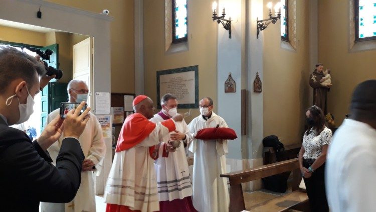 Cardinal Wilton Gregory blesses his titular church with holy water