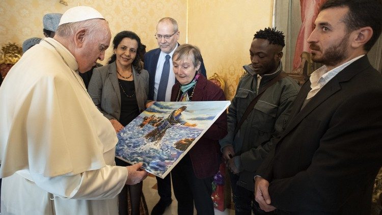 The group gave the Pope a painting of a migrant crossing the sea