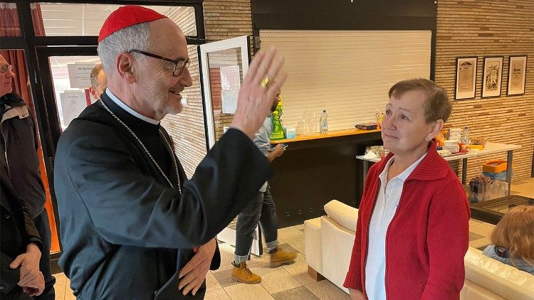 The Cardinal with a Ukrainian refugee
