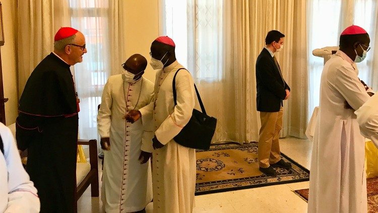Cardinal Czerny talks with a pair of Senegalese Bishops