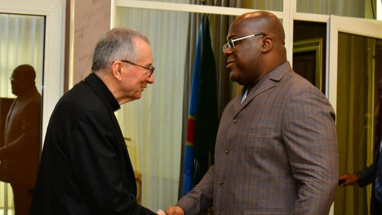 Cardinal Parolin shakes hands with President Tshisekedi