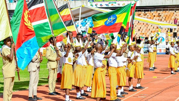 Children hold national flags at the opening Mass of the Bishops of Eastern Africa
