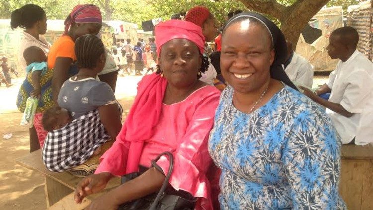 Sister Anne (R) at a refugee camp in Abuja