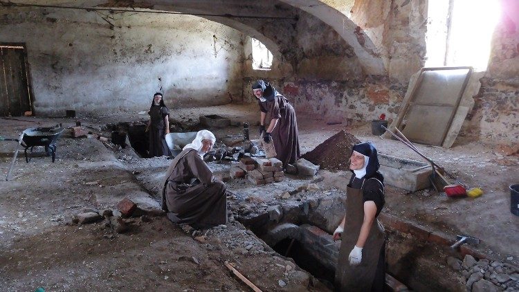 The sisters working on the foundations of their new house