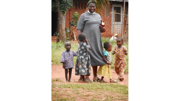 Children hanging onto the skirts of one of the sisters