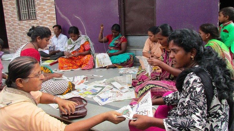 Apostolic Carmelite Sister leading a tailoring group for women