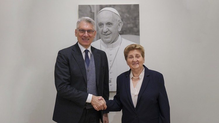 Tiziano Onesti (L) shakes hands with Mariella Enoc