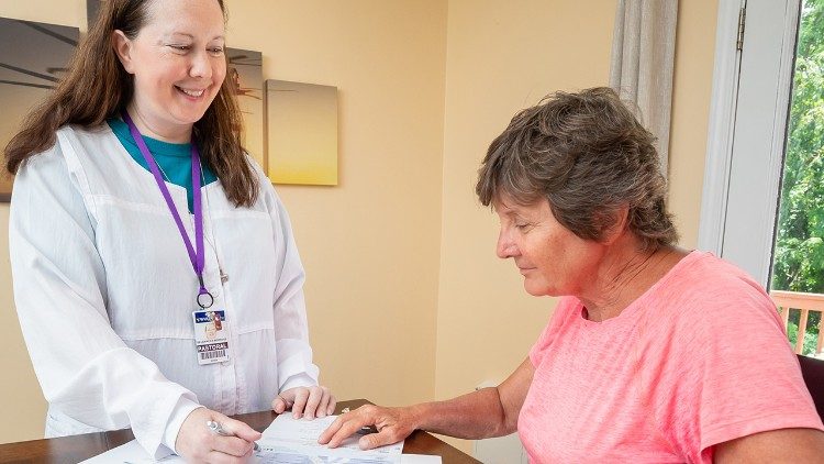 Sister Jennifer explains the hospital transition programs to a client (courtesy of Catholic Charities West Virginia)