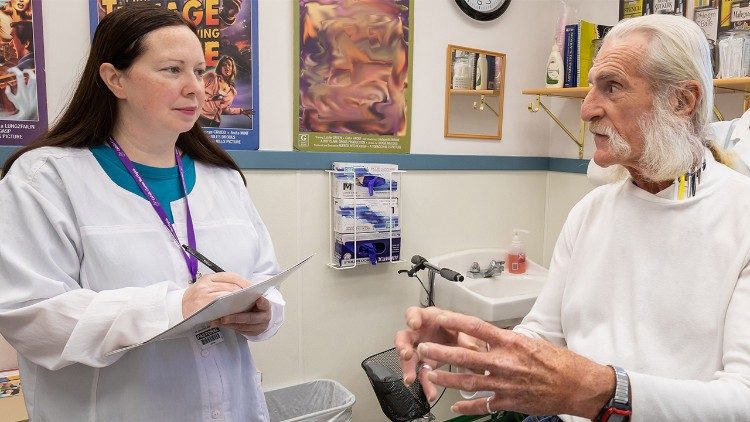 Sister Jennifer conferring with a new patient about discharge needs (courtesy of Catholic Charities West Virginia)