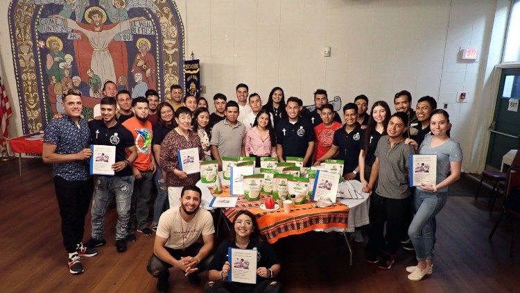 Participants in the Quinoa Project get a recipe booklet and bag of quinoa to take home after a session on nutrition and cooking demonstration (Photo Credit: Catherine McWilliams)