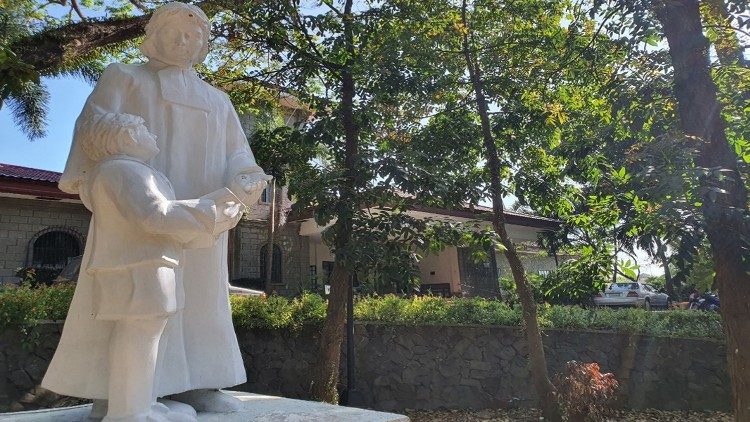 Statue of St. John Baptist De La Salle with a child (courtesy of Mr. Jose Ritche Bongcaron)