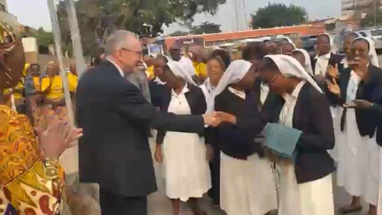  Welcome to the Secretary of State by a group of the faithful.